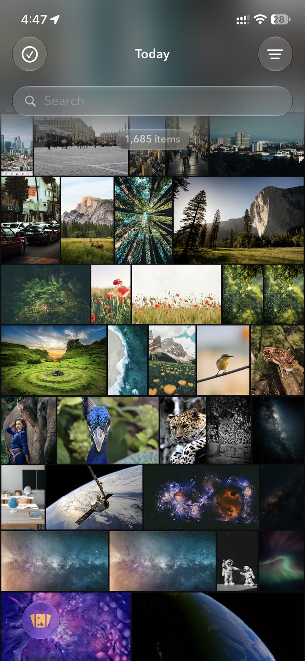 PhotoMesh gallery on iPhone, 1,685 photos from every source in one timeline