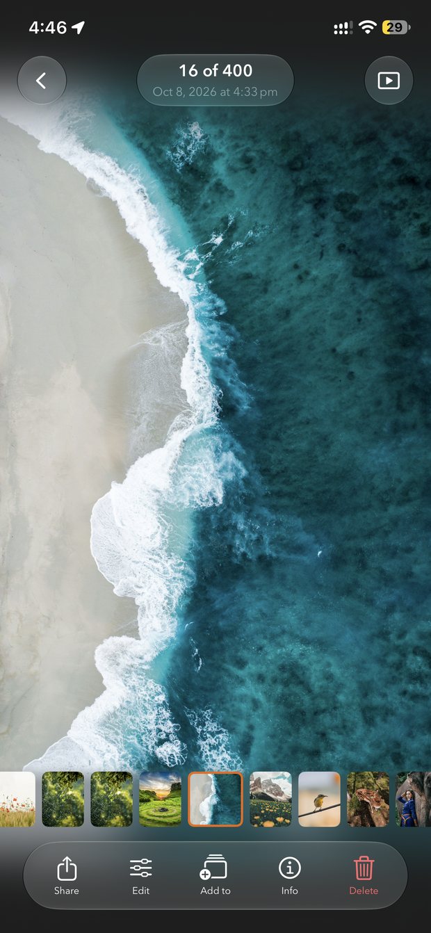 PhotoMesh photo viewer on iPhone showing an aerial ocean photo, 16 of 400